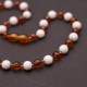 Polished Baroque Style Cognac Baltic Amber With Howlite Teething Necklace