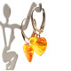 Heart-shaped honey-colored amber earrings with a 925 silver hook