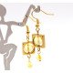 Gold-colored earrings with yellow polished amber