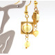 Gold-colored earrings with yellow polished amber