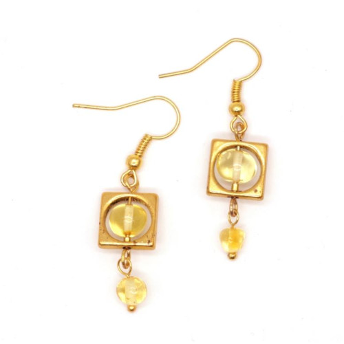Gold-colored earrings with yellow polished amber