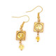 Gold-colored earrings with yellow polished amber