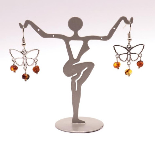 Butterfly-shaped earrings with amber pieces in baroque shape in cognac color