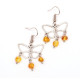 Butterfly-shaped earrings with amber pieces in baroque shape