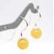 Silver earrings with a butter colored amber ball