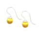 Silver earrings with a yellow amber ball