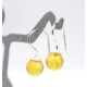 Silver earrings with a yellow amber ball