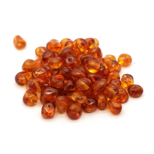 Polished baroque style amber lose beads in cognac color 4-6.5 mm