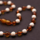 Polished Baroque Style Cognac Baltic Amber With Onyx Teething Necklace