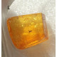 Small Baltic amber piece with insect inclusion in transparent plastic box  