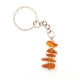 Key-ring with polished amber