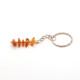 Key-ring with polished amber