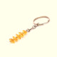 Key-ring with polished amber