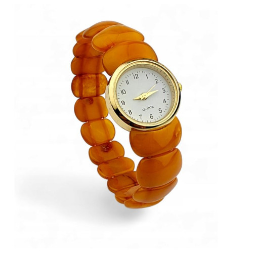 Gold color wristwatch with egg yolk amber strap