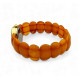 Gold color wristwatch with egg yolk amber strap