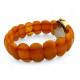 Gold color wristwatch with egg yolk amber strap