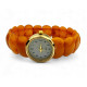 Gold color wristwatch with egg yolk amber strap