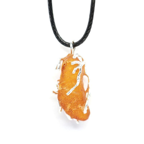 Raw amber pendant in a metal frame 47