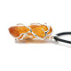 Raw amber pendant in a metal frame 47